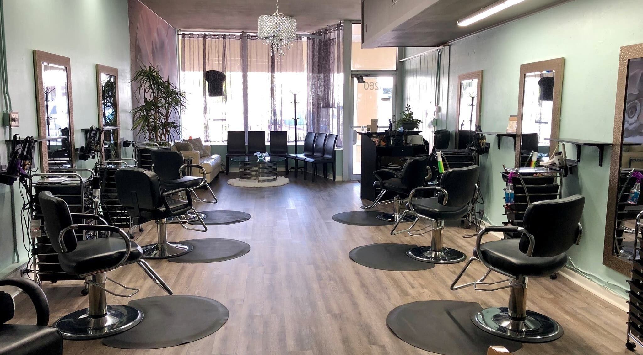 Spacious and stylish interior of B and B Hair Salon Llc in Clearwater, Florida, US with chairs and mirrors.
