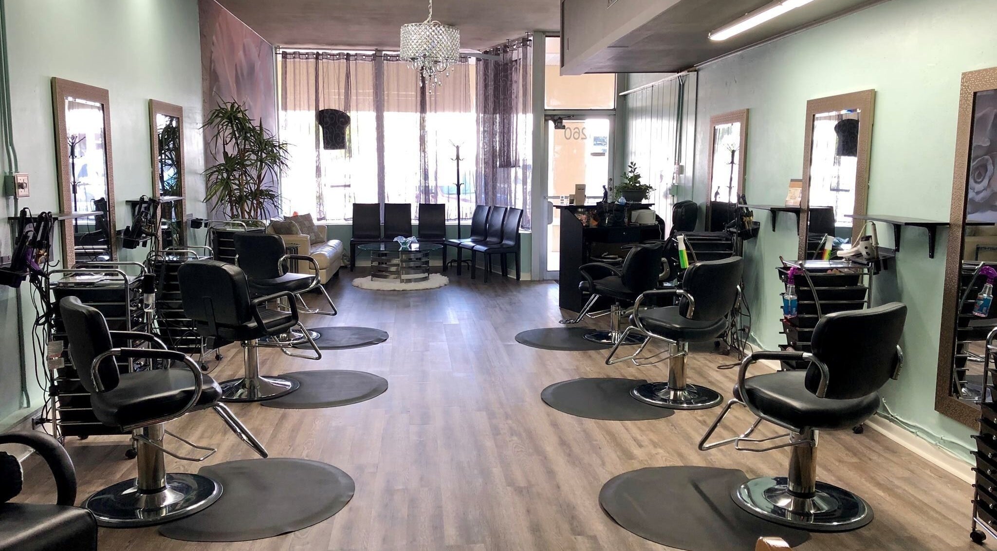 Spacious and stylish interior of B and B Hair Salon Llc in Clearwater, Florida, US with chairs and mirrors.