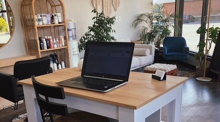 Interior of Accents Hair Studio showcasing chic decor and a comfortable seating area in Nanaimo, British Columbia, CA.