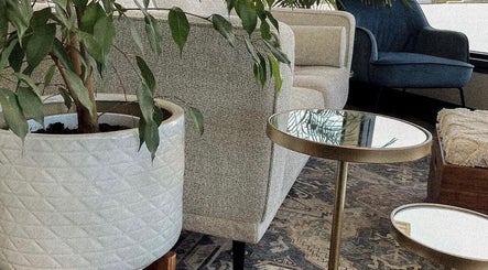 Modern lounge area at Accents Hair Studio in Nanaimo, British Columbia, CA with cozy seating and stylish decor.