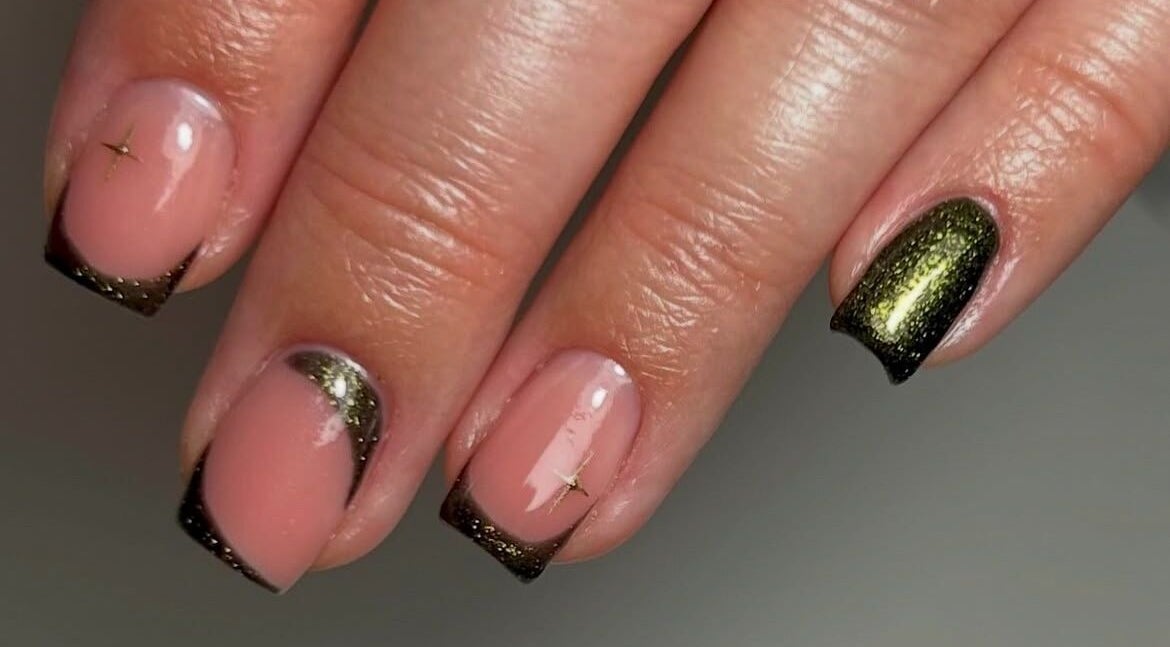 Stylish nail design at Estelle’s Beauty Room, Rugeley, England, GB with pink and black accents.