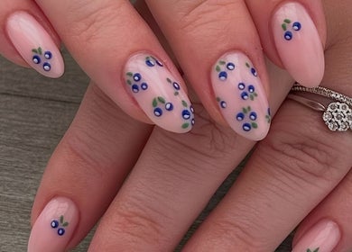 Nail art with delicate blue floral designs at Estelle’s Beauty Room, Rugeley, England, GB.
