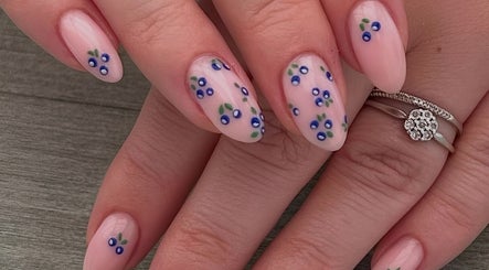 Nail art with delicate blue floral designs at Estelle’s Beauty Room, Rugeley, England, GB.