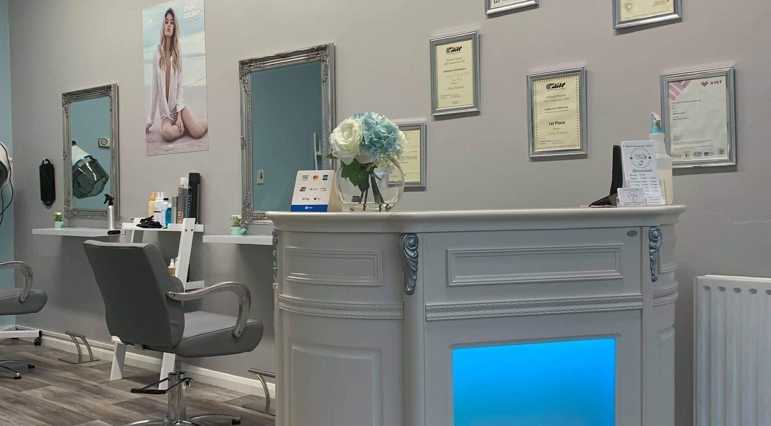 Reception area of Hair by Chloe in Holbeach, England, GB with modern decor and salon certificates on wall.