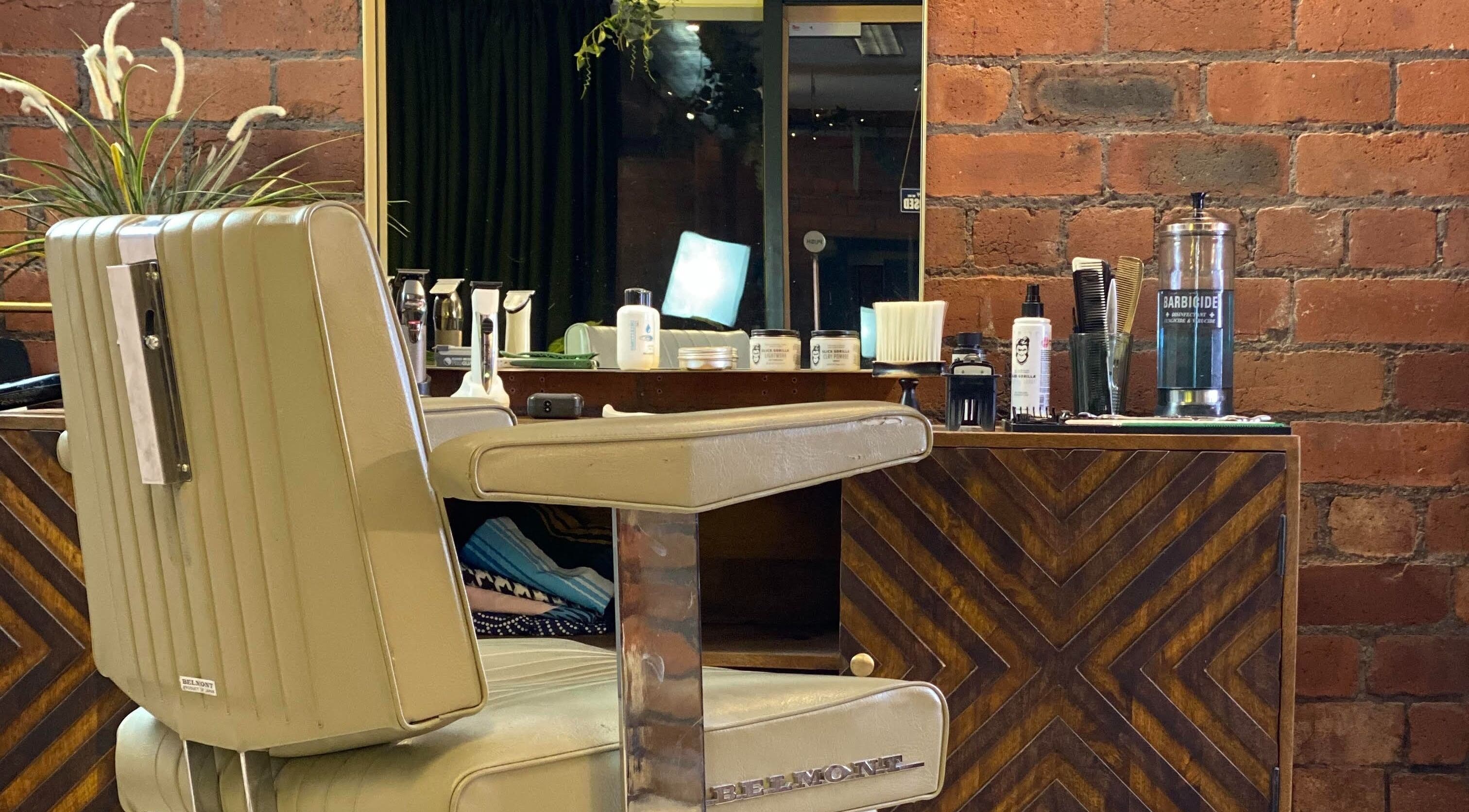 Elegant hair styling station at It's The Hair Studio, Liverpool, England, GB, featuring vintage barber chair.