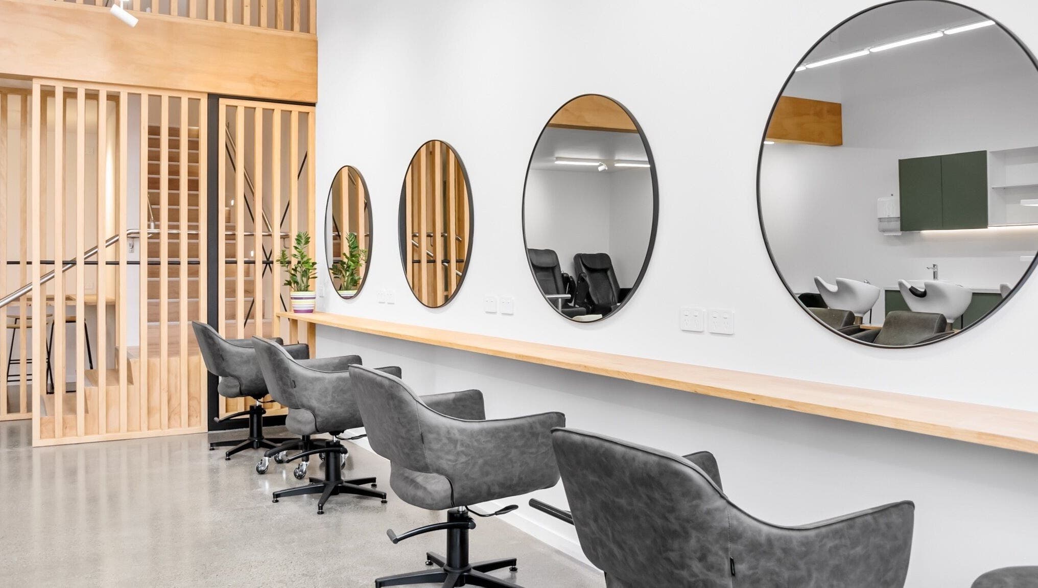 Modern salon chairs and mirrors at Beutiq, Wellington, Wellington, NZ showcasing elegant design.