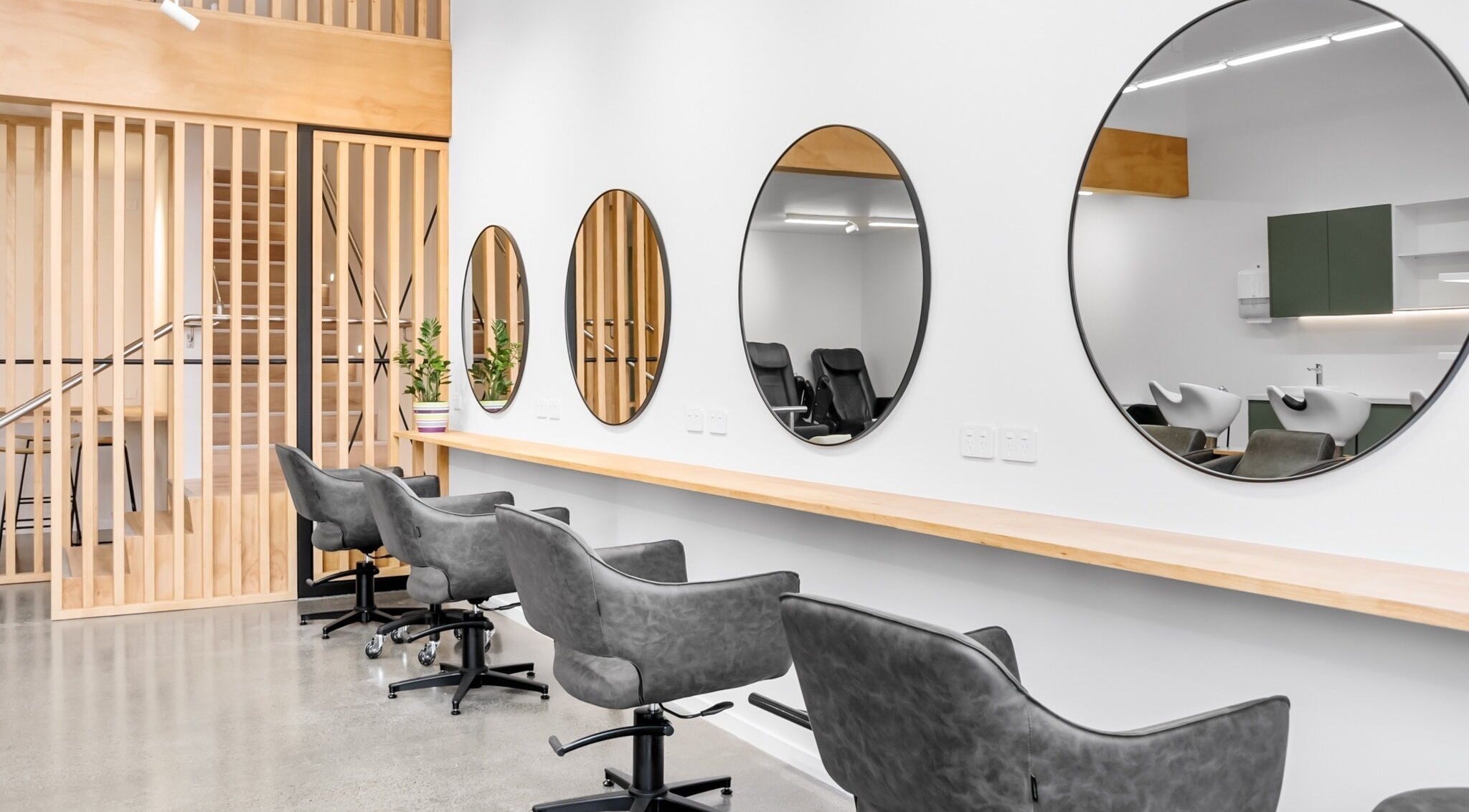 Modern salon chairs and mirrors at Beutiq, Wellington, Wellington, NZ showcasing elegant design.
