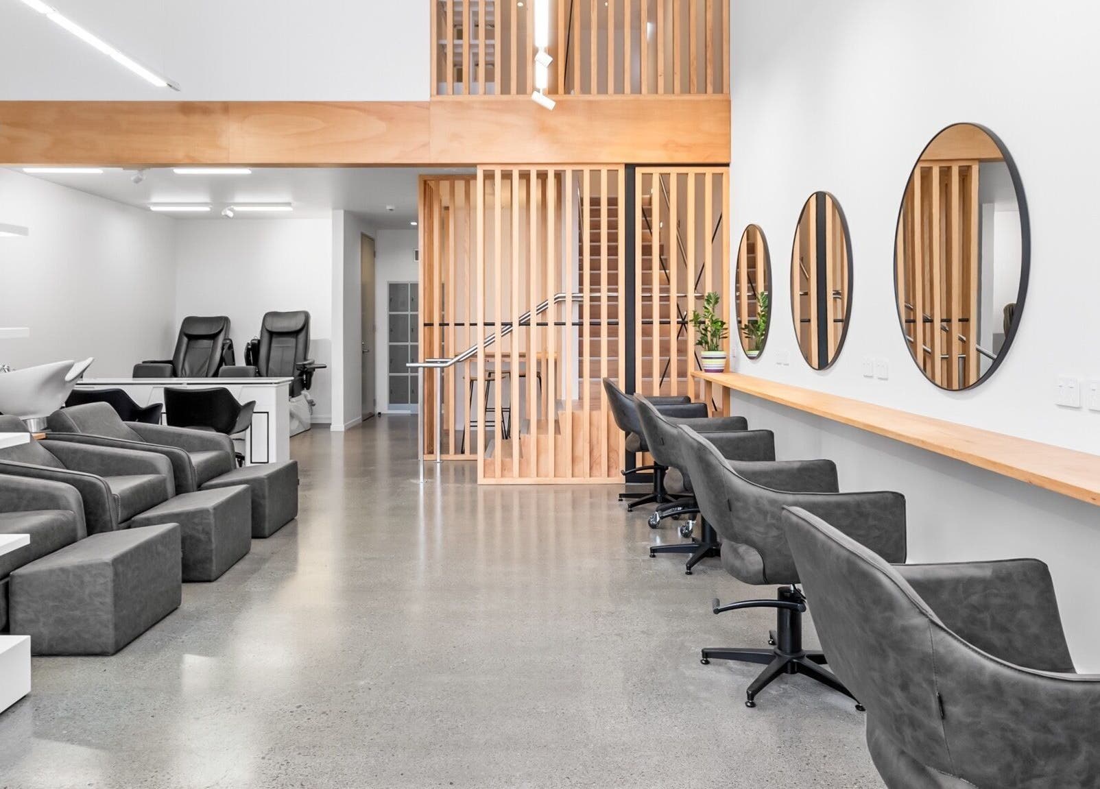 Modern interior of Beutiq in Wellington, NZ with sleek chairs and stylish decor.