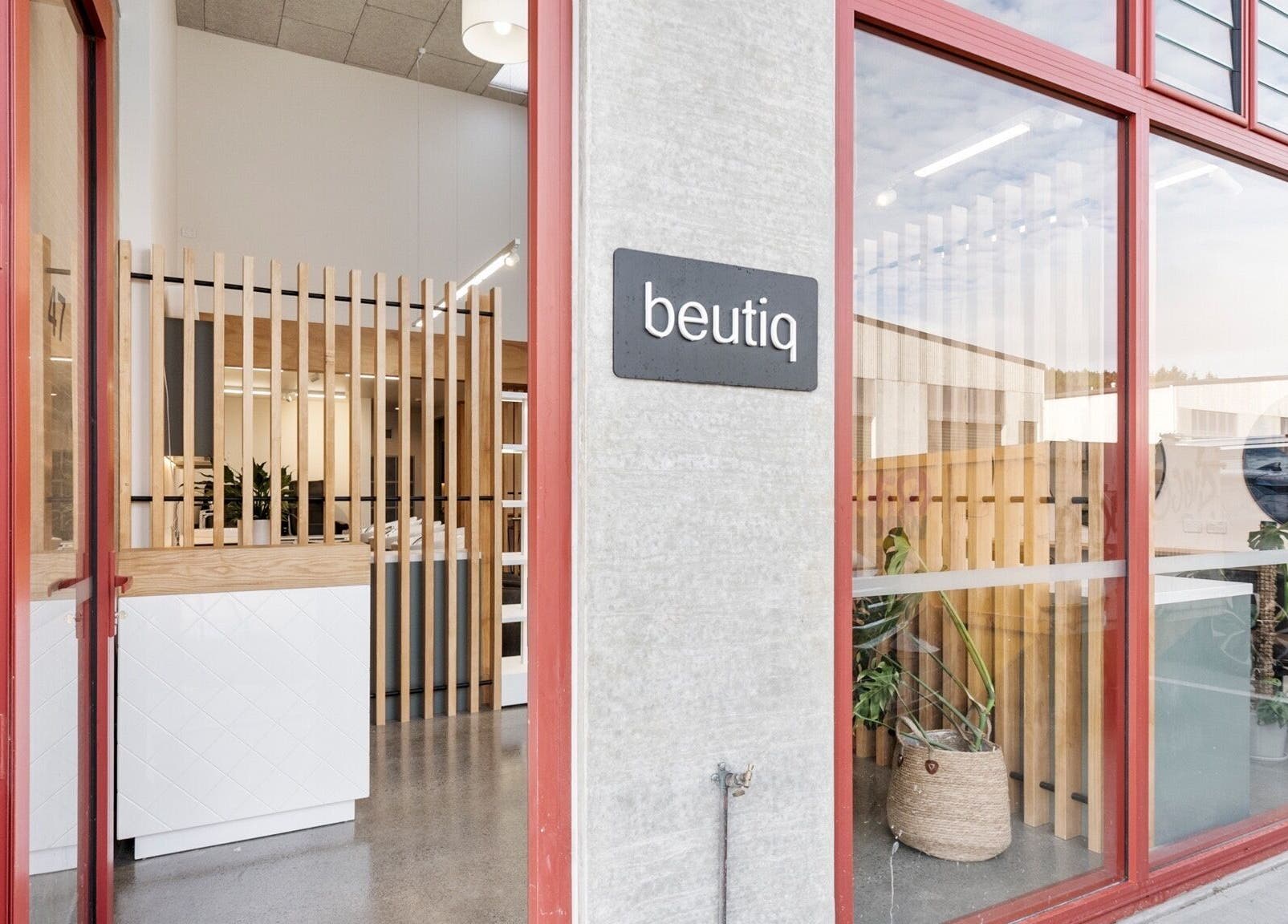 Beutiq salon entrance with modern design in Wellington, Wellington, NZ showcasing inviting wooden accents.