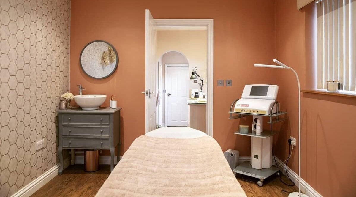 Relaxing massage room at The Brick House Beauty, Stafford, England, GB with warm tones and modern decor.