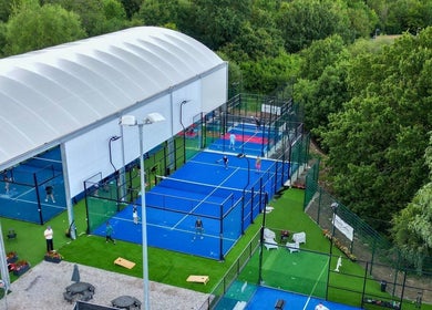 Padel courts at M20 Health & Performance @ MPC, Heald Green, England, surrounded by greenery.