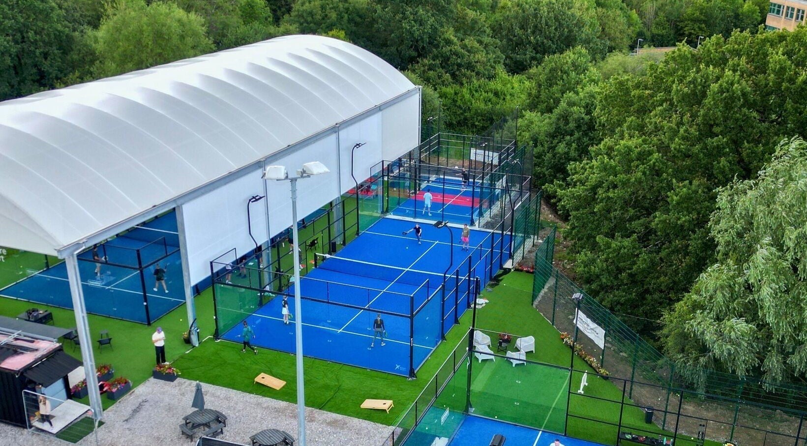 Padel courts at M20 Health & Performance @ MPC, Heald Green, England, surrounded by greenery.