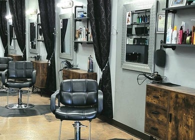 Elegant salon interior at Salon 360 Indy, Indianapolis, Indiana, US, with stylish black chairs and mirrors.