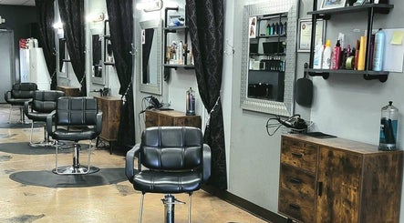 Elegant salon interior at Salon 360 Indy, Indianapolis, Indiana, US, with stylish black chairs and mirrors.