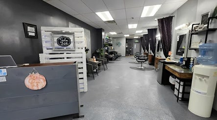 Modern interior of Salon 360 Indy in Indianapolis, Indiana, US, featuring stylish seating and decor.