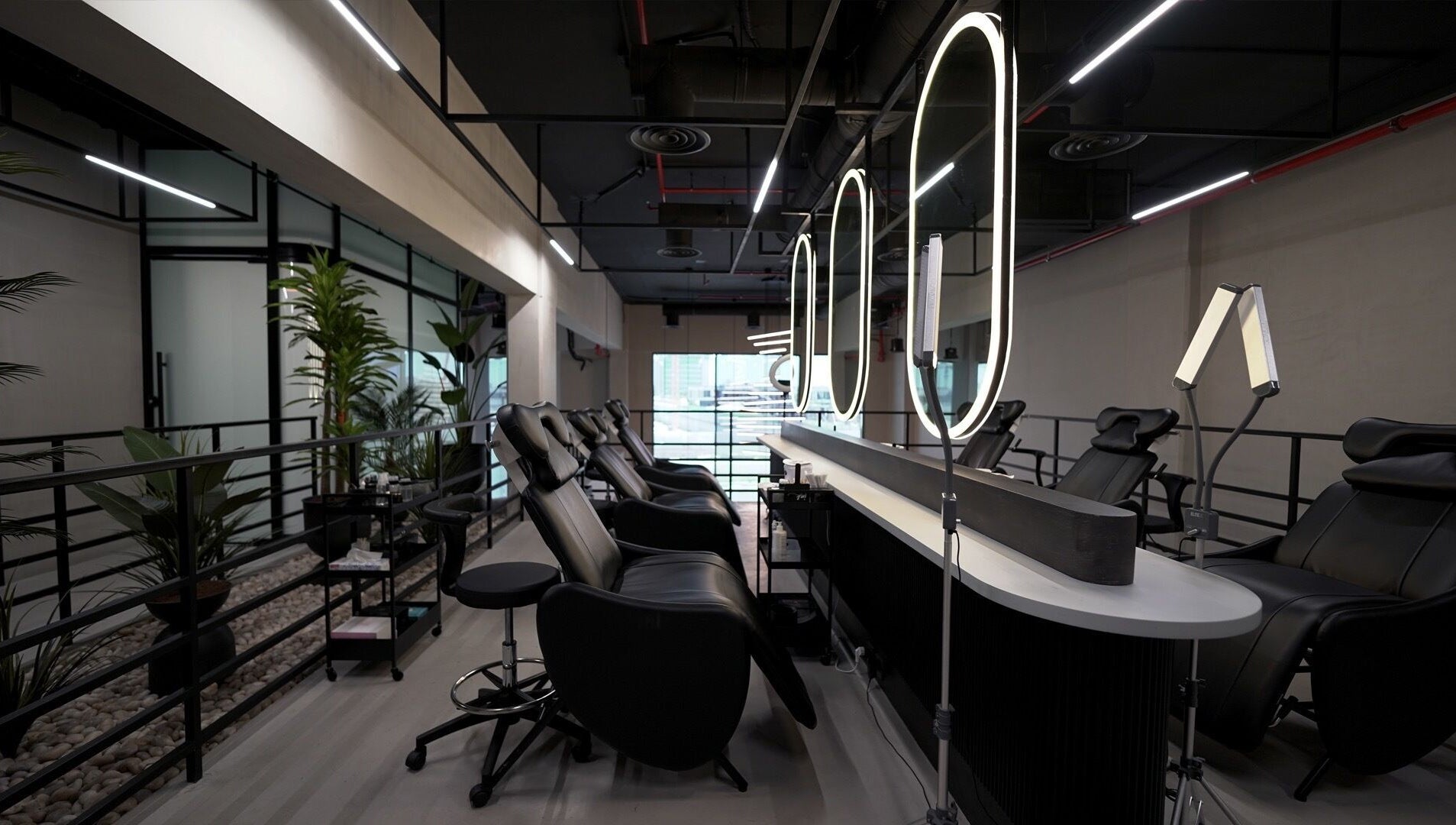Modern beauty lounge setup at Ink Brows & Beauty - Khobar, Al Khobar, Eastern Province, SA with elegant chairs.