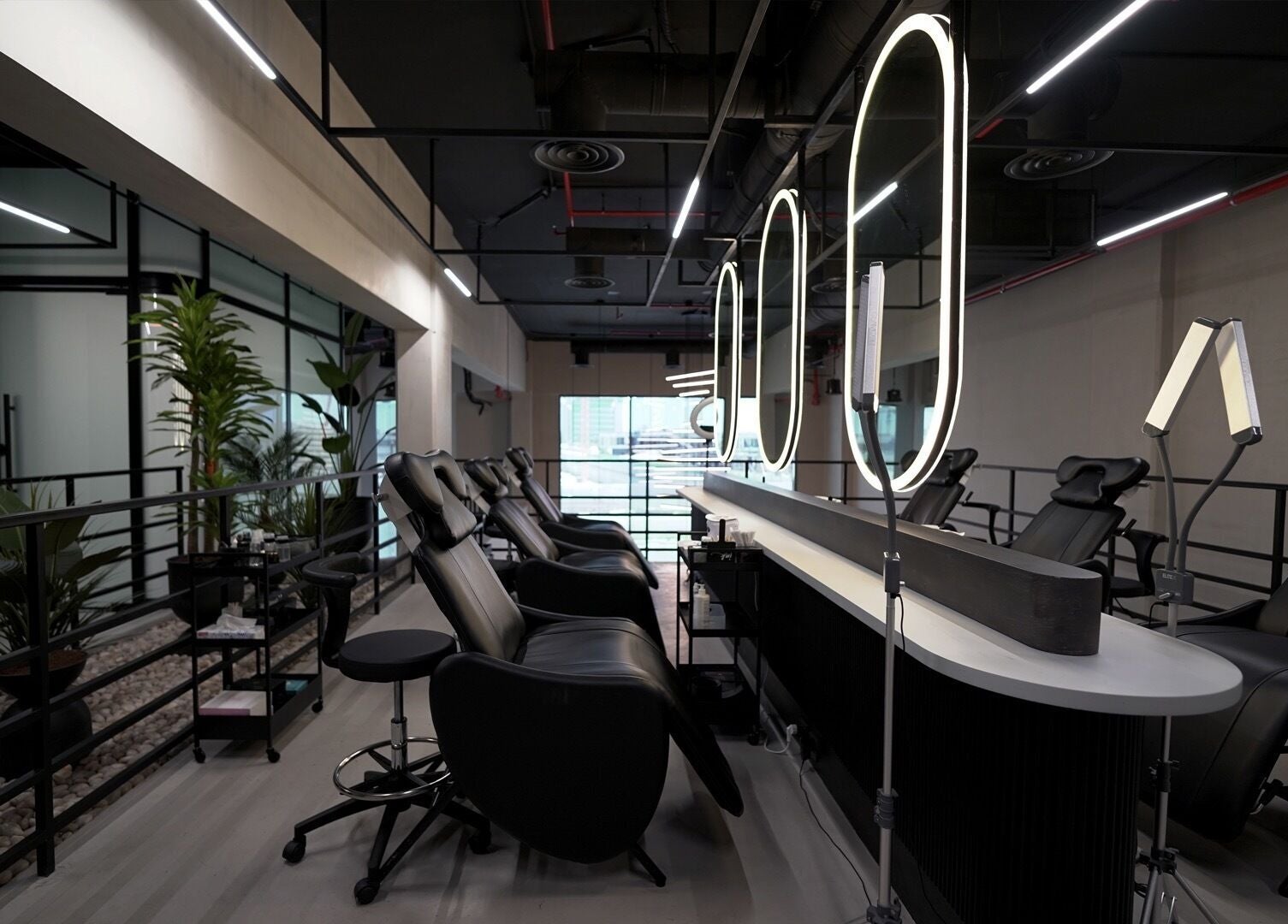 Modern beauty lounge setup at Ink Brows & Beauty - Khobar, Al Khobar, Eastern Province, SA with elegant chairs.