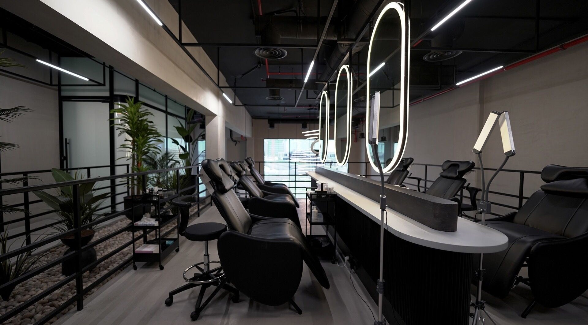 Modern beauty lounge setup at Ink Brows & Beauty - Khobar, Al Khobar, Eastern Province, SA with elegant chairs.