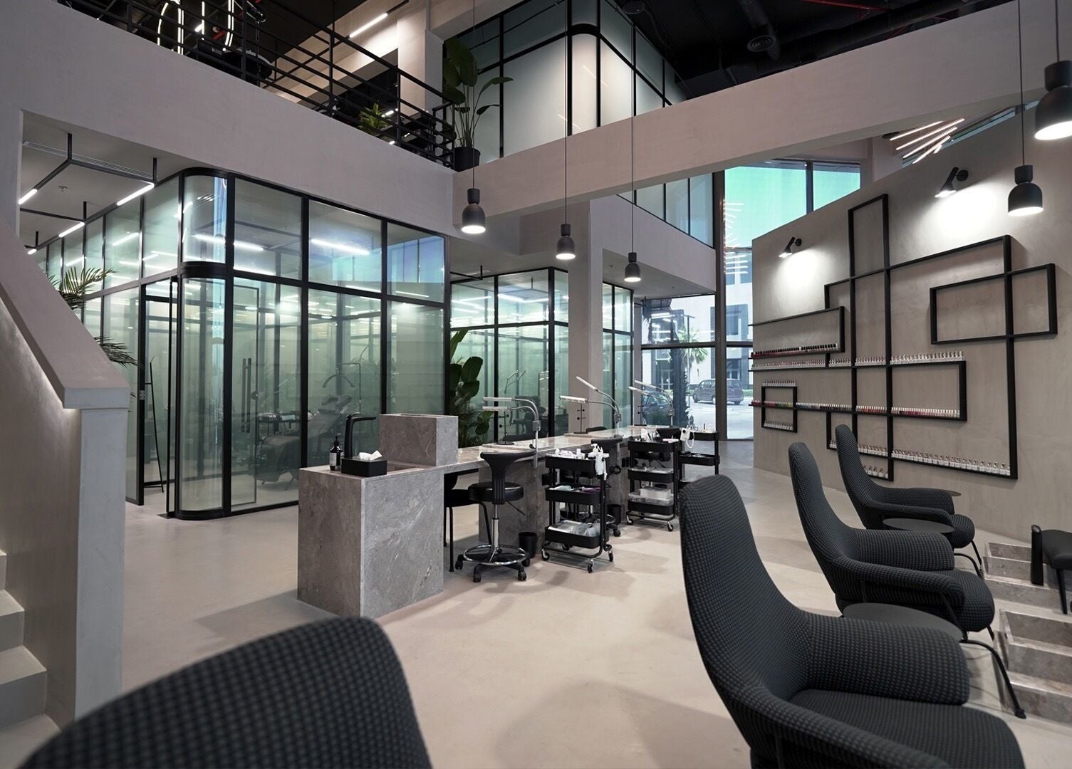 Modern interior of Ink Brows & Beauty - Khobar in Al Khobar, Eastern Province, SA, featuring sleek design and elegant chairs.