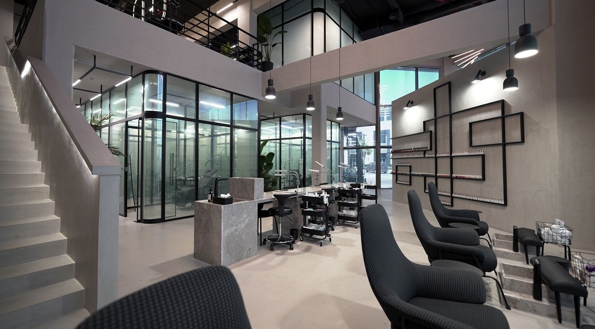 Modern interior of Ink Brows & Beauty - Khobar in Al Khobar, Eastern Province, SA, featuring sleek design and elegant chairs.