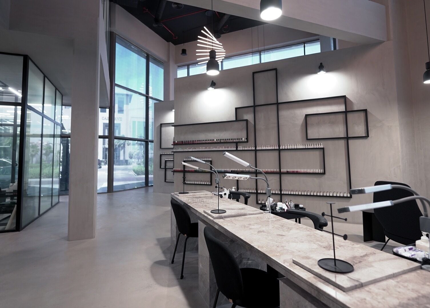 Modern nail salon at Ink Brows & Beauty - Khobar in Al Khobar, Eastern Province, SA with sleek decor and large windows.