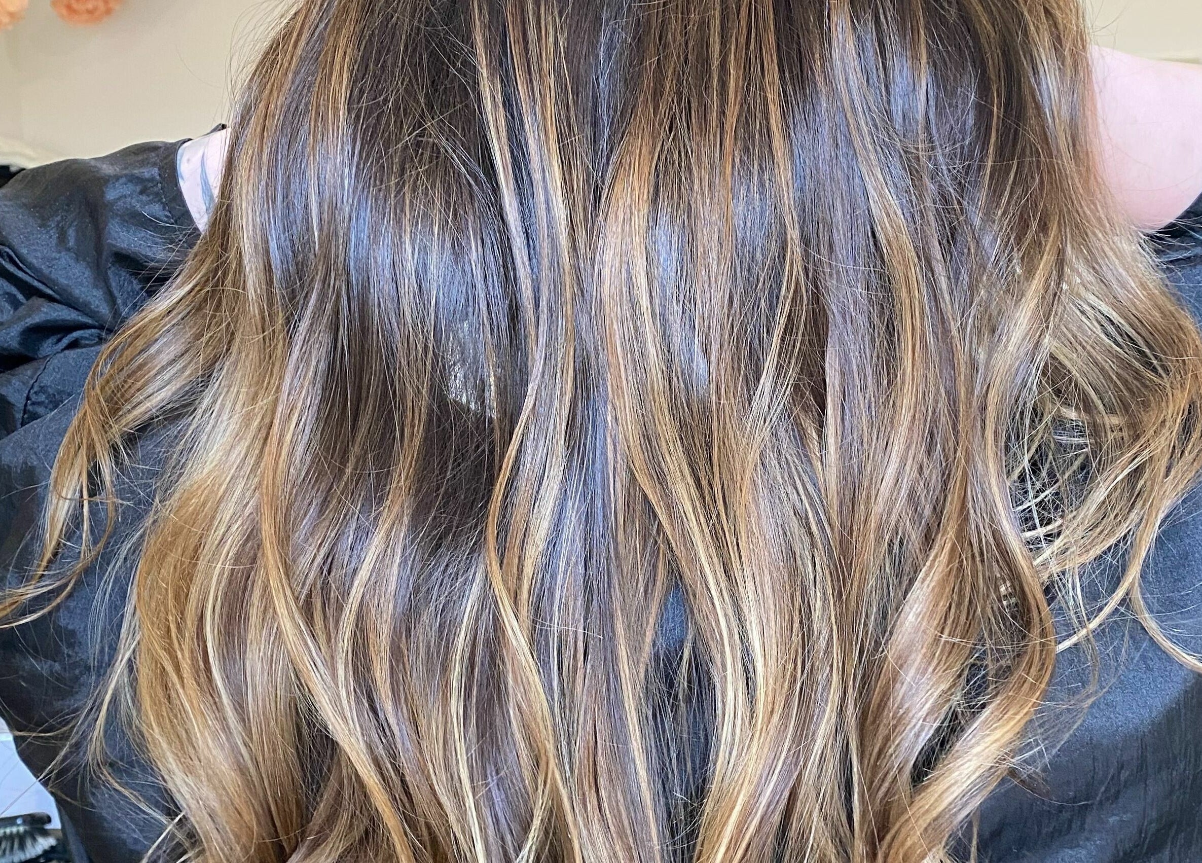 Long, rich brown hair at Tom Syed Hair Spa, Stourbridge, England, GB showcasing expert styling.