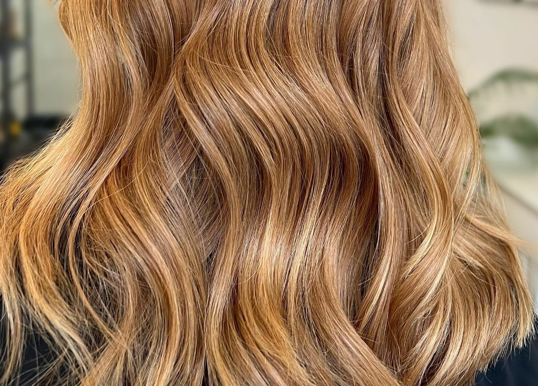 Wavy golden hair styled at Tom Syed Hair Spa, Stourbridge, England, GB showing luxurious texture.