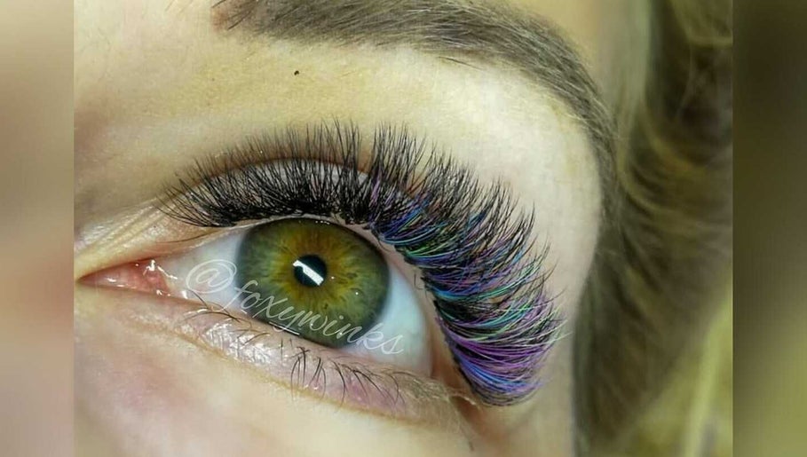Vibrant eyelash extensions at FoxyWinks Beauty, Bowmanville, Ontario, CA, showcasing colorful and stylish design.