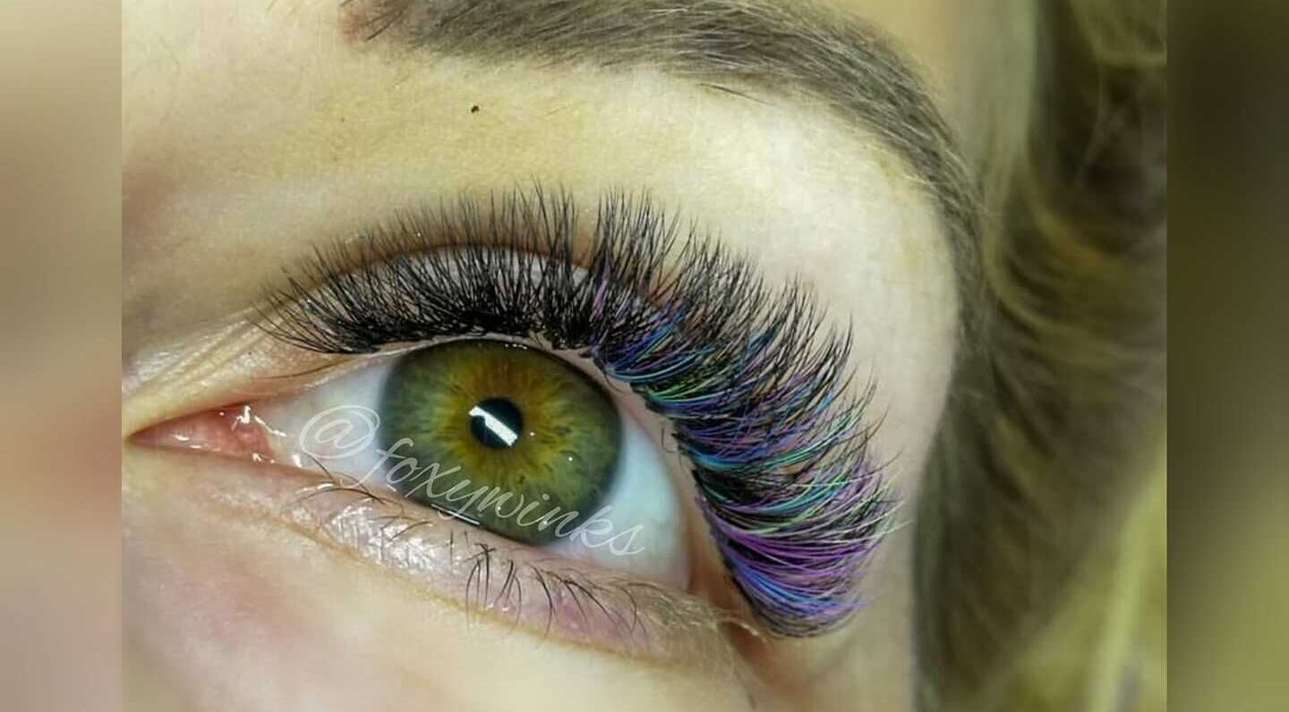 Close-up of eye with colorful lashes at FoxyWinks Beauty, Oshawa, Ontario, CA.