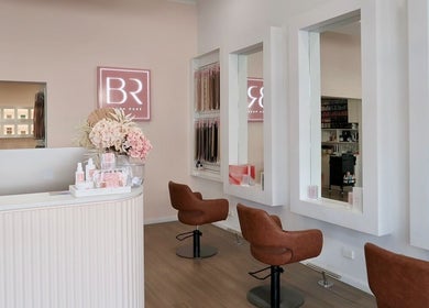 Interior of Blush Rose Hair Extensions, Melbourne, Victoria, AU with stylish chairs and mirrors.