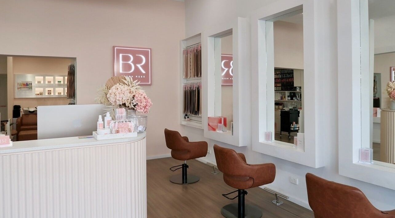 Interior of Blush Rose Hair Extensions, Melbourne, Victoria, AU with stylish chairs and mirrors.