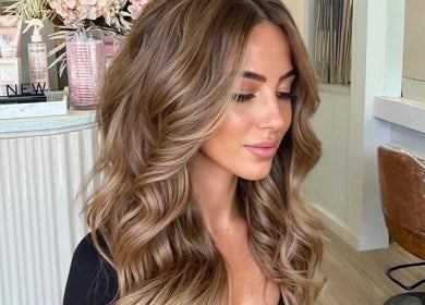 Woman with stylish curls at Blush Rose Hair Extensions, Melbourne, Victoria, AU.