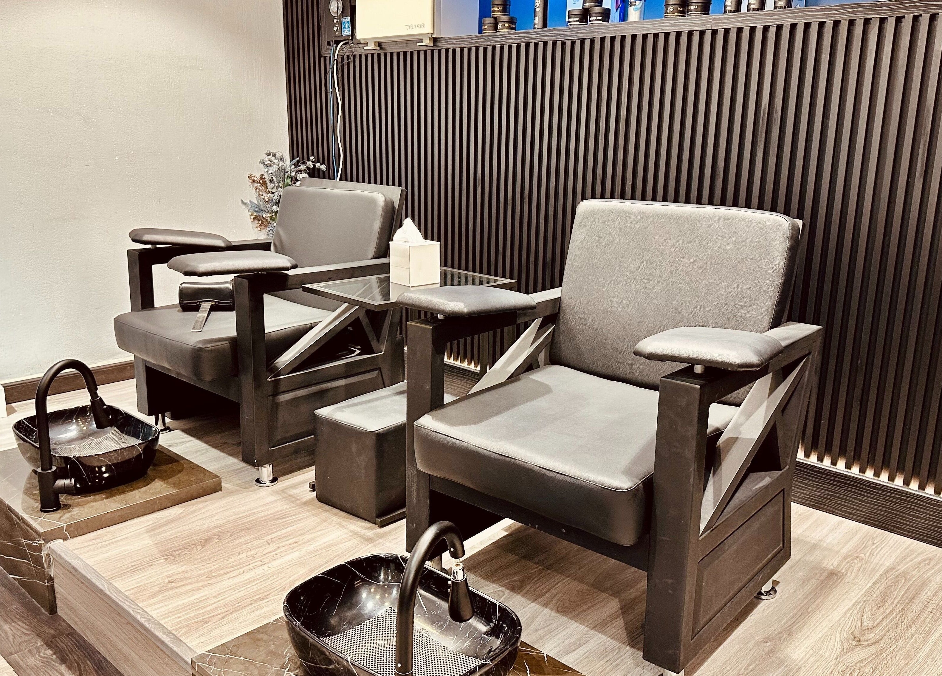 Luxurious pedicure chairs at Shadow Chic Gents Salon, Dubai, Dubai, AE, offering premium relaxation.