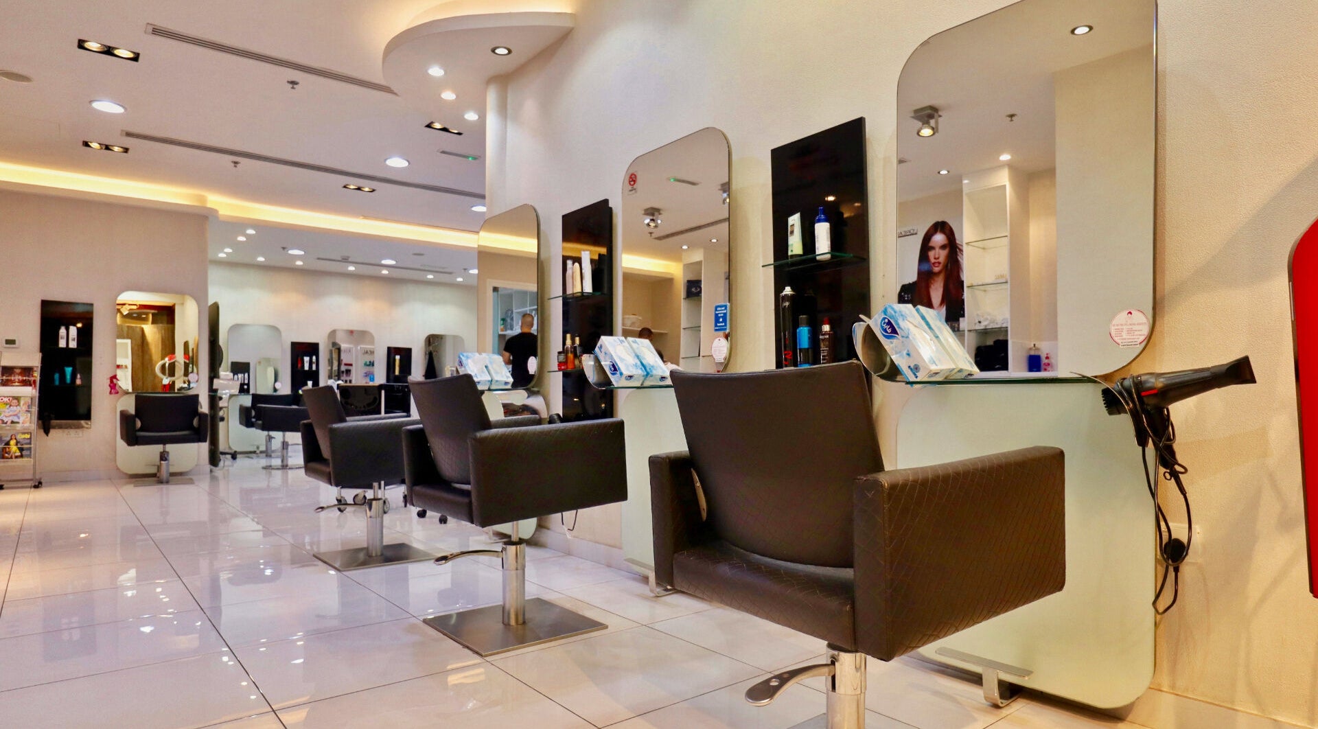 Chic interior of Shadow Chic Beauty Ladies Salon in Dubai, AE, featuring stylish chairs and mirrors.