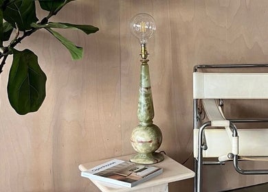 Cuttlefish Eco Salon - Hove features a stylish corner with a plant, marble lamp, and chair in Brighton And Hove, England, GB.