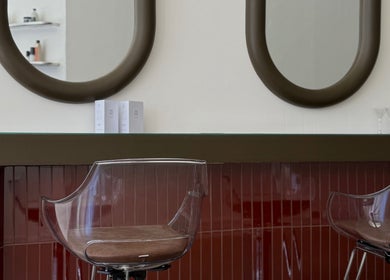 Elegant styling area at Cuttlefish Eco Salon - Worthing, featuring modern mirrors and sleek chairs. Worthing, England, GB.