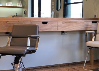 Modern salon chairs at Cuttlefish Eco Salon - Brighton, located in Brighton, England, GB.