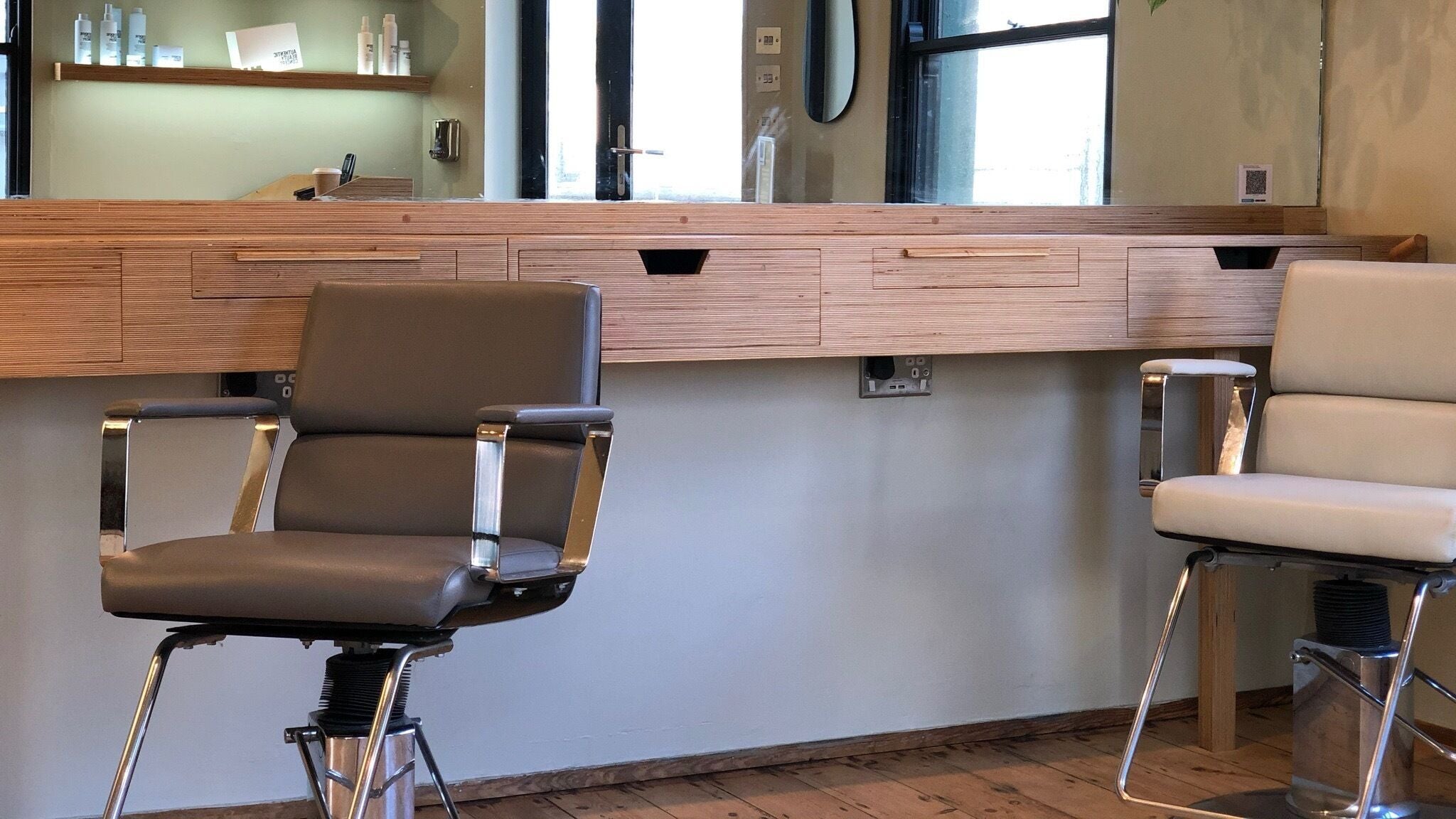 Modern salon chairs at Cuttlefish Eco Salon - Brighton, located in Brighton, England, GB.