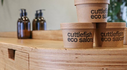 Brown cardboard cups at Cuttlefish Eco Salon - Brighton reflecting sustainable practices, Brighton, England, GB.