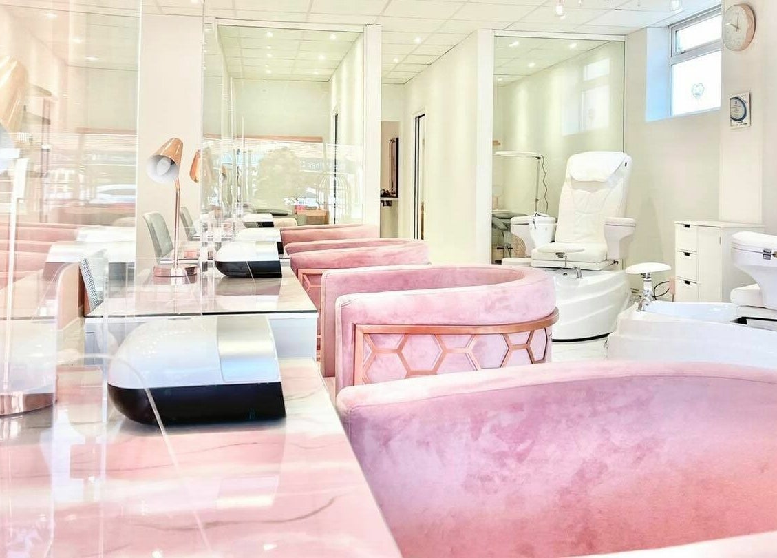 Chic salon interior with plush pink chairs at The Beauty Studio, Hayling Island, England, GB.