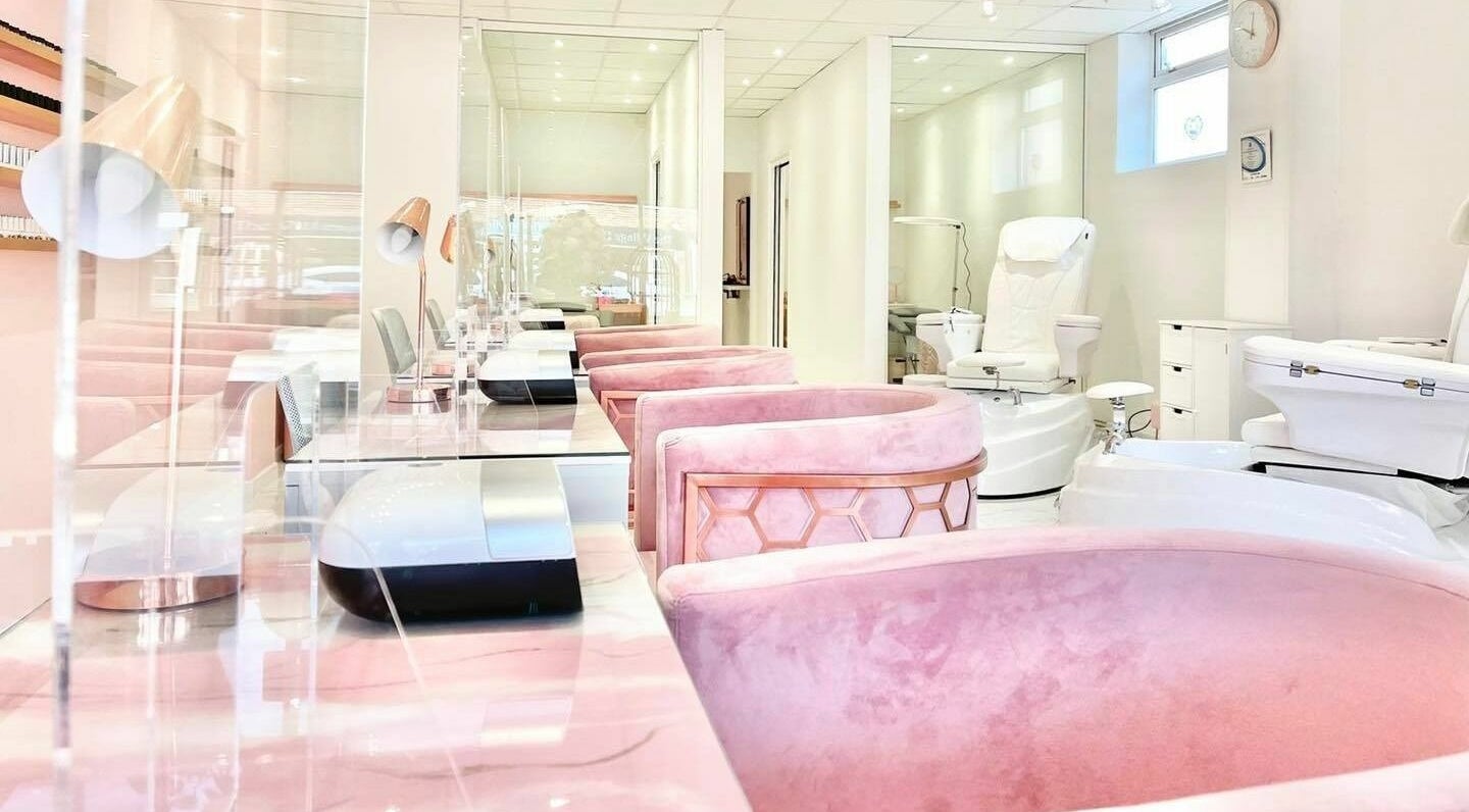 Chic salon interior with plush pink chairs at The Beauty Studio, Hayling Island, England, GB.