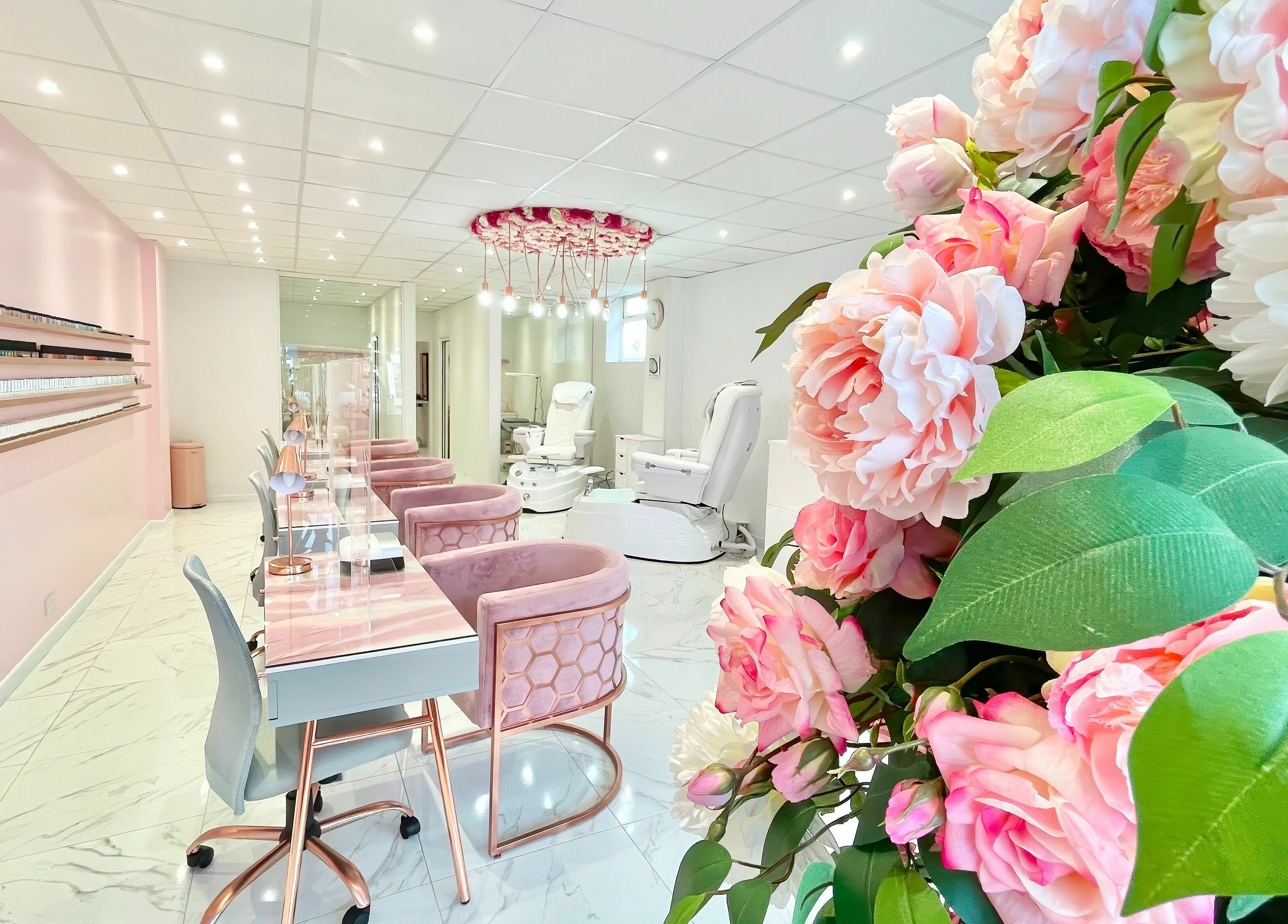 Elegant interior of The Beauty Studio, Hayling Island, England, GB with floral decor and plush seating.