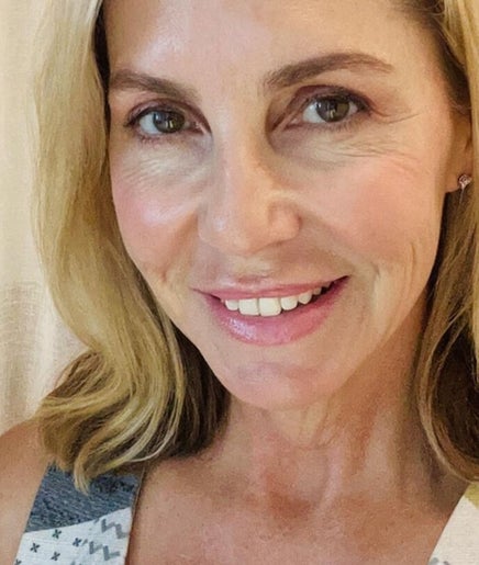 Smiling person at Society Isle Beauty and Wellbeing, Bulimba, Queensland, AU exuding warmth and relaxation.