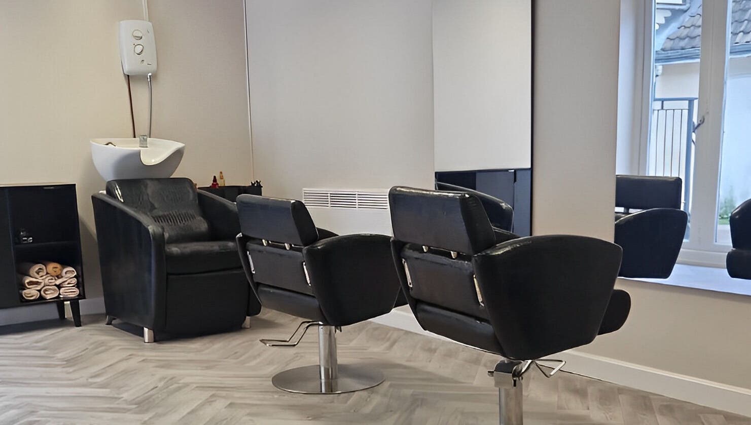 Elegant salon chairs at Omree Laser and Aesthetics in Stoke-on-Trent, England, GB, showcasing modern design.