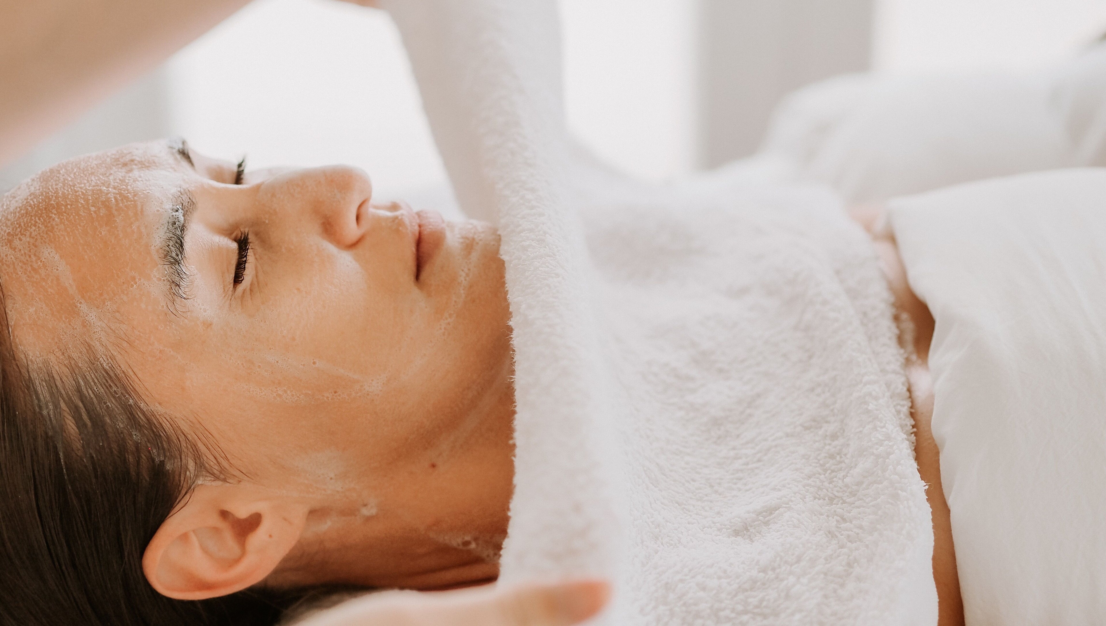 Relaxing facial treatment at SKINFUSIONS in Yeppoon, Queensland, AU showcasing serene client experience.