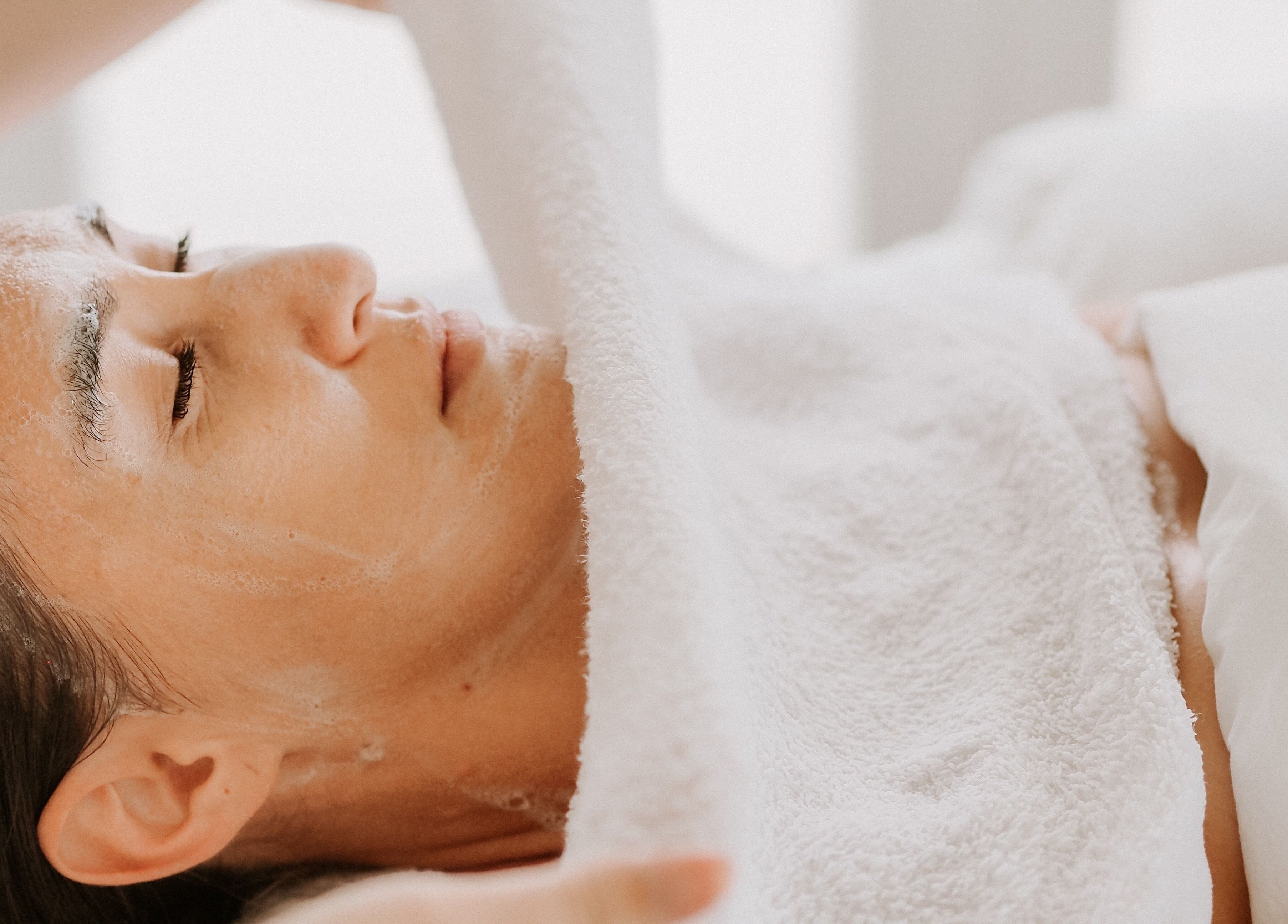 Relaxing facial treatment at SKINFUSIONS in Yeppoon, Queensland, AU showcasing serene client experience.