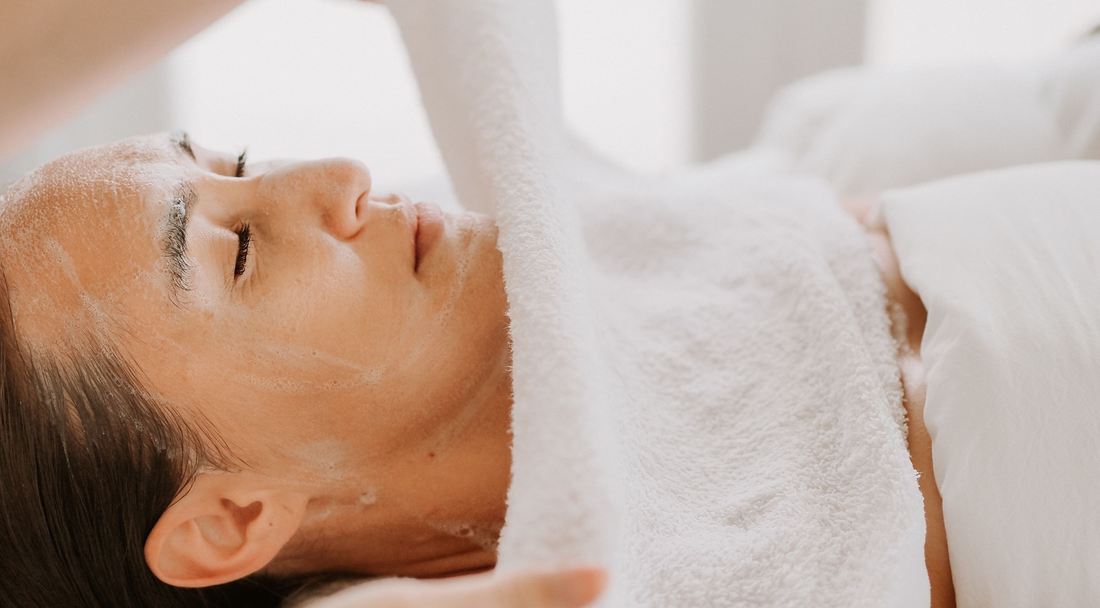 Relaxing facial treatment at SKINFUSIONS in Yeppoon, Queensland, AU showcasing serene client experience.