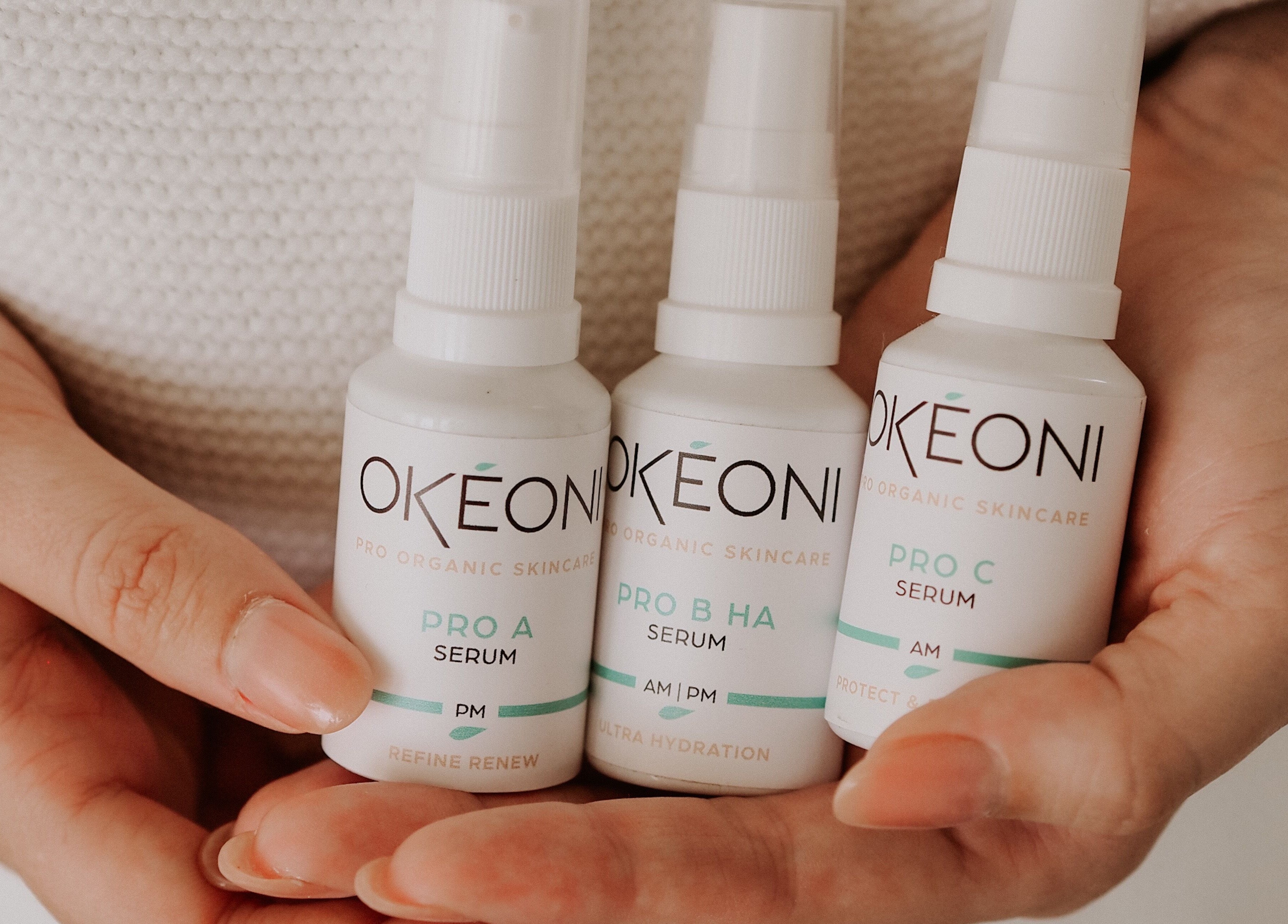 Hands holding skincare serums at SKINFUSIONS, Yeppoon, Queensland, AU.
