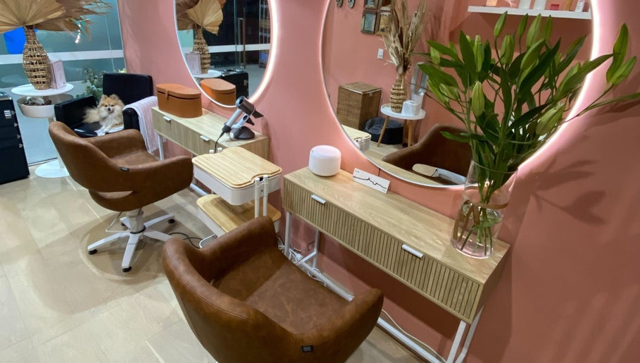 Elegant salon interior at Rachel French Hairdresser, Sydney, New South Wales, AU, with plush chairs and stylish decor.