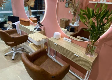 Elegant salon interior at Rachel French Hairdresser, Sydney, New South Wales, AU, with plush chairs and stylish decor.